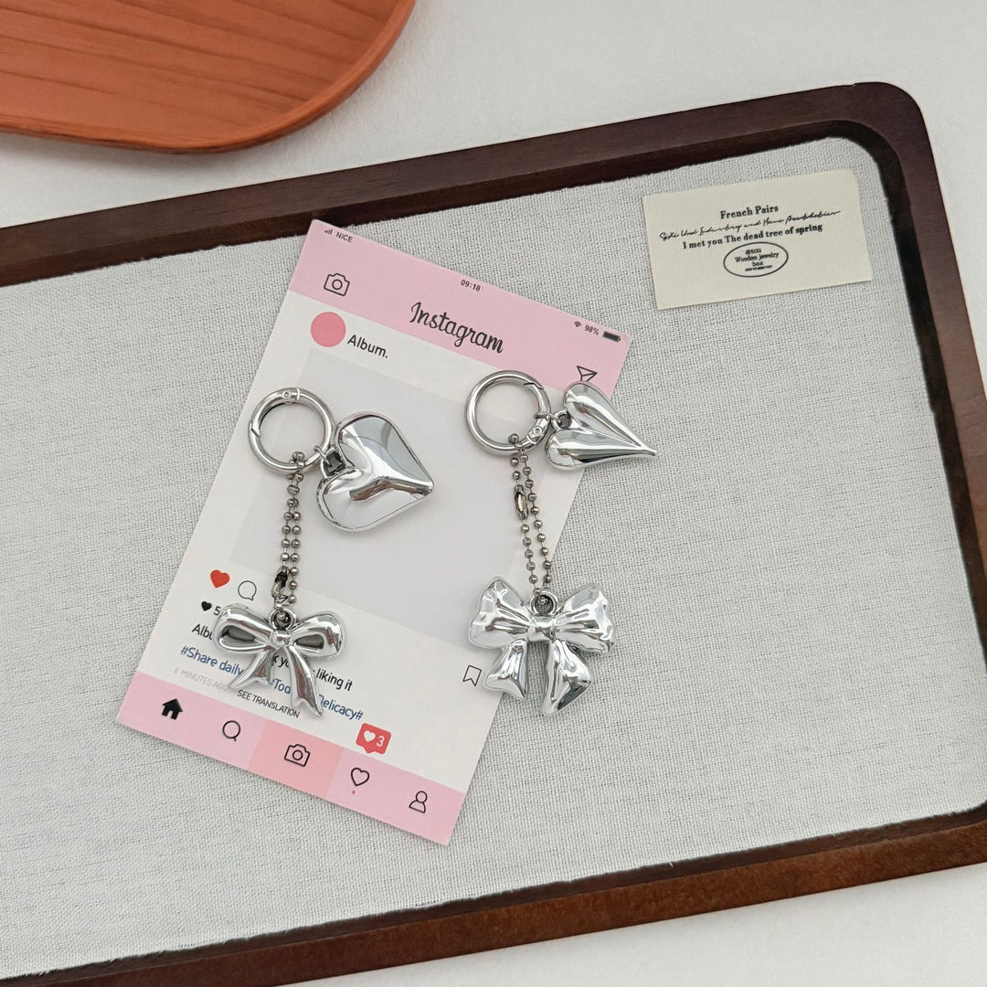 Heart-Shaped Charm Keychain with Bow Bowlift