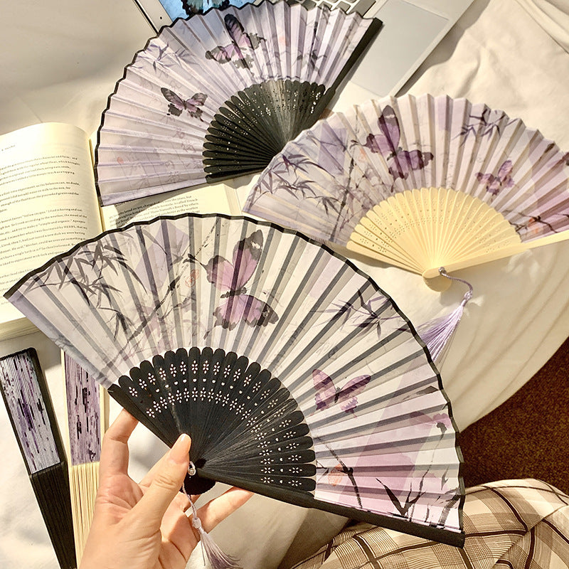 Elegant fan with elaborate butterfly motif Bowlift