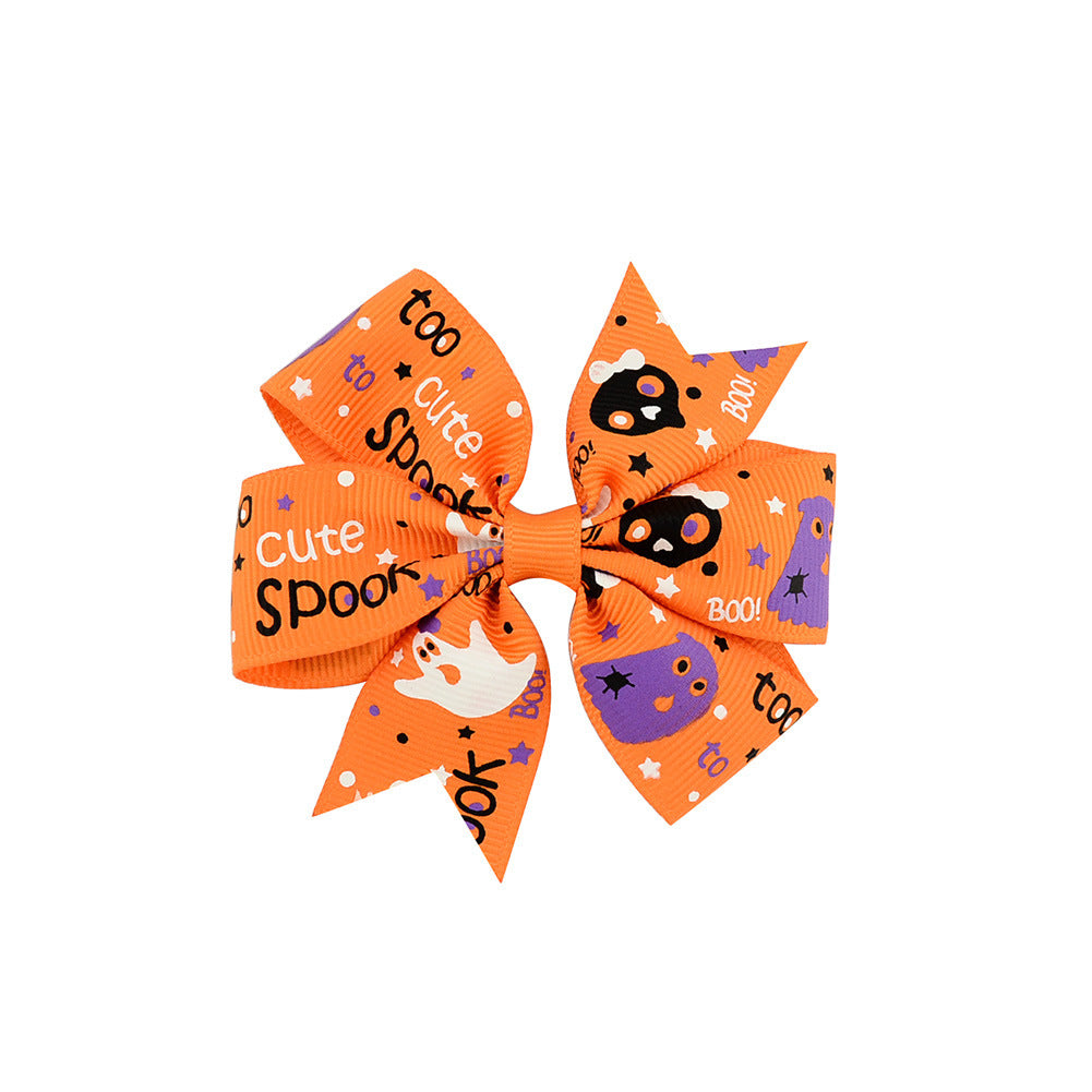 Halloween bow with pumpkin and witch motifs