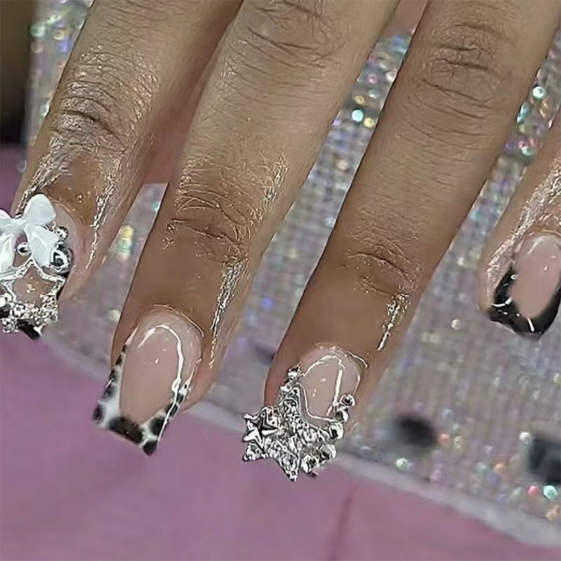 Acrylic nail set with glamorous starlights and elegant embellishments Bowlift