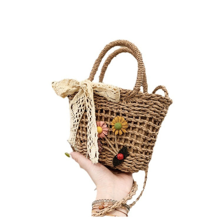Playful basket bag with floral appliqués Bowlift