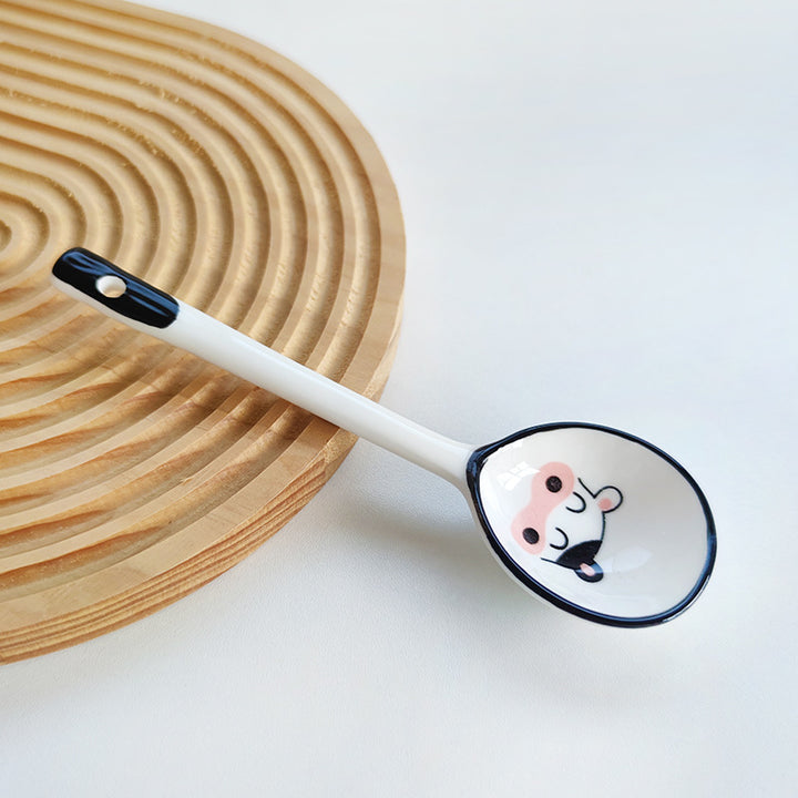 Ceramic soup spoon with lucky cat illustration and ergonomic long-handle Bowlift