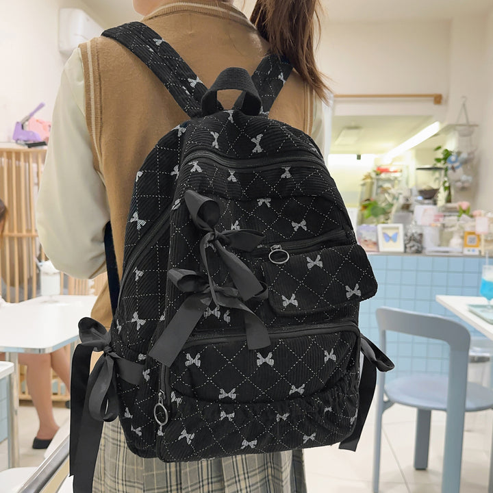 Playful backpack with bow details and practical compartments Bowlift