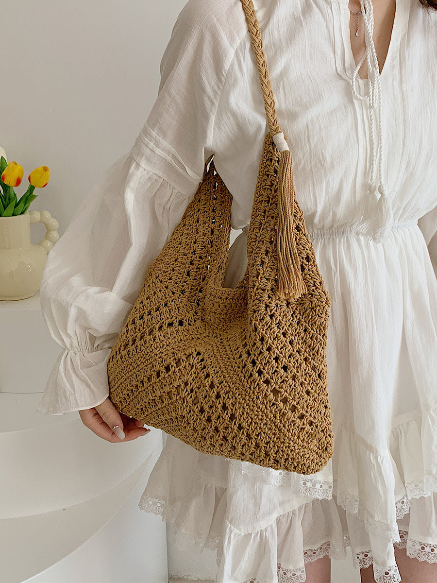 Hand-knotted shoulder bag with tassels and spacious interior Bowlift