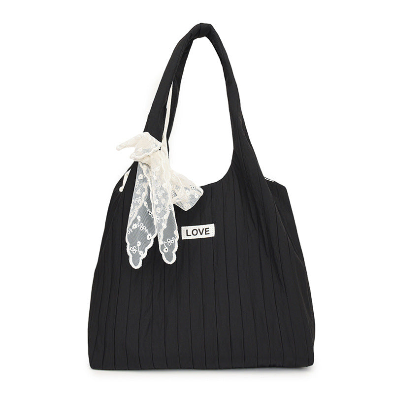 Leisure bag with structured design and playful scarf Bowlift