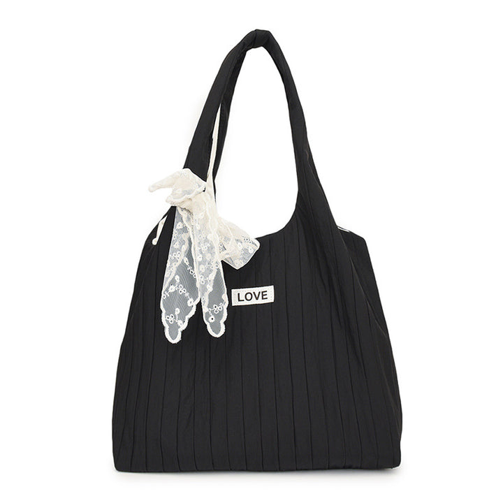 Leisure bag with structured design and playful scarf Bowlift