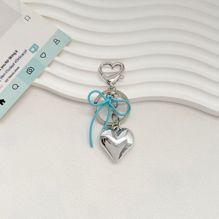 Heart-Shaped Metallic Keychain with Decorative Bow Bowlift