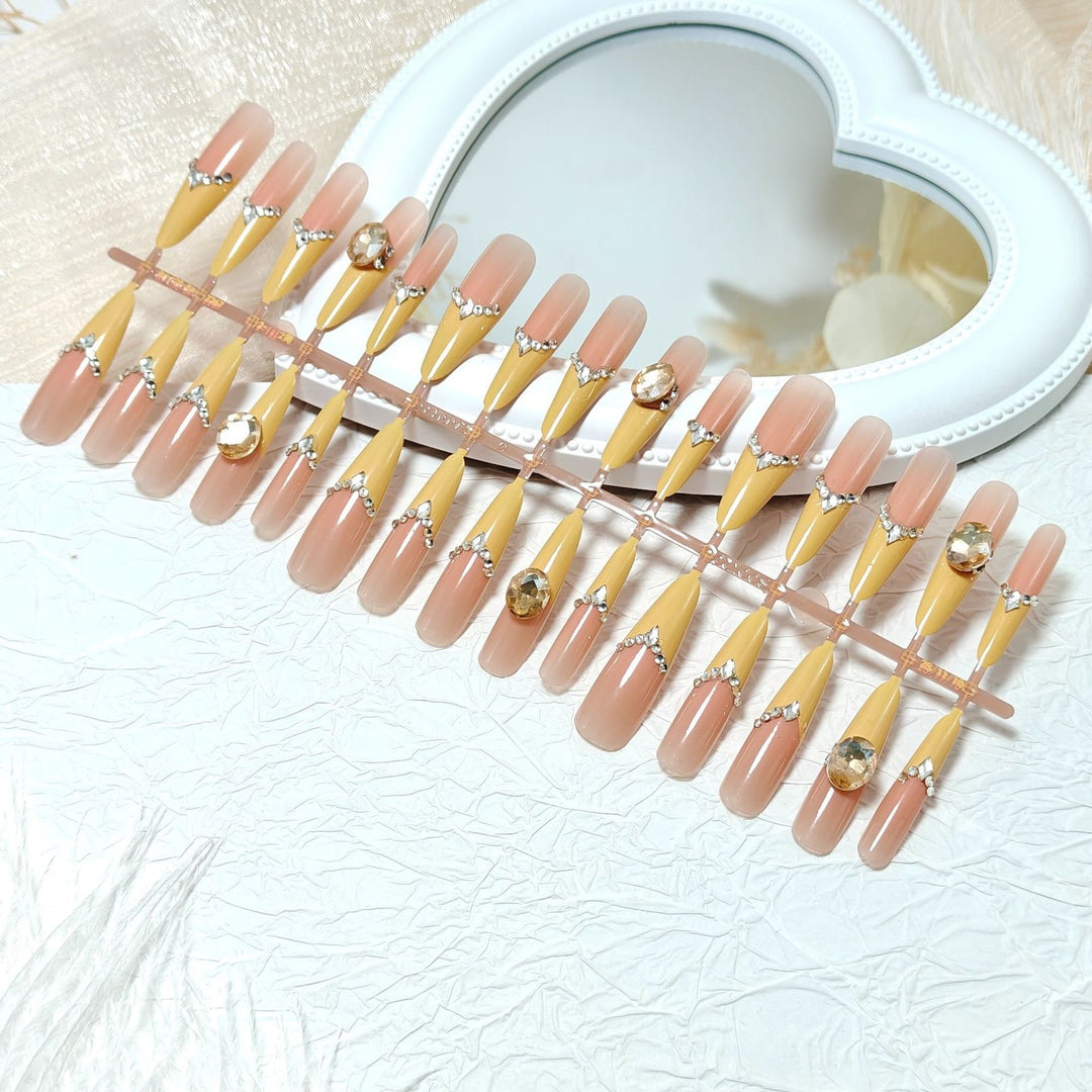 Artificial nails with elegant 3D applications and glitter Bowlift