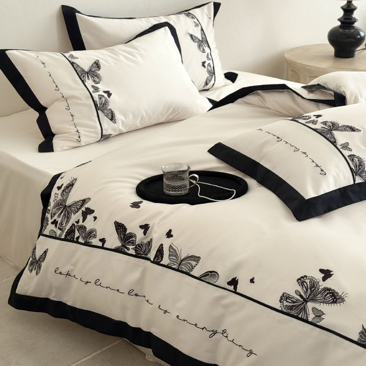Luxurious cotton satin bedding set with butterfly embroidery and contrasting piping Bowlift
