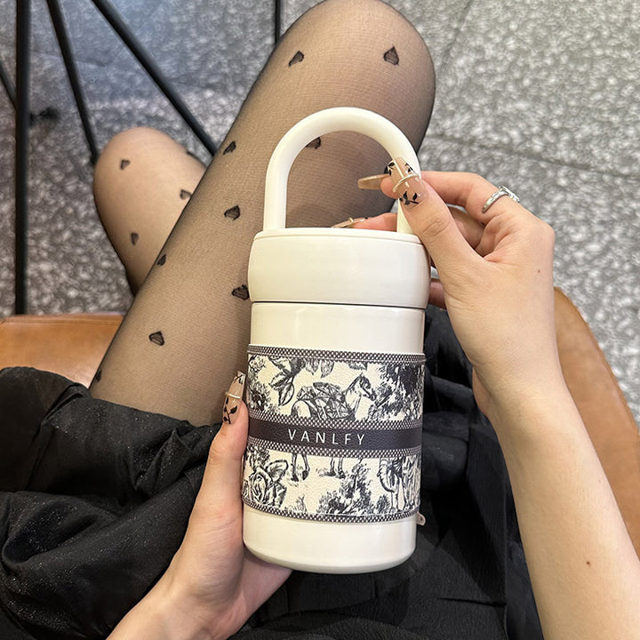 Women's stylish thermos cup with practical carrying handle Bowlift