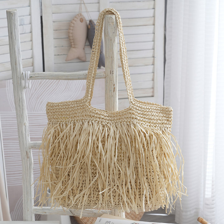Trendy raffia bag with fringed details Bowlift