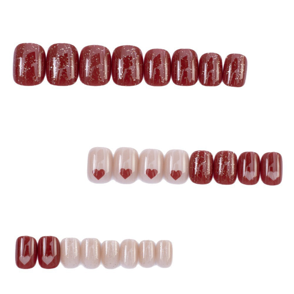 Art nail set with heart designs and glitter Bowlift