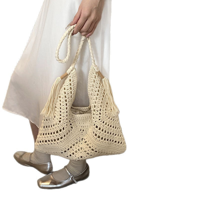 Hand-knotted shoulder bag with tassels and spacious interior Bowlift