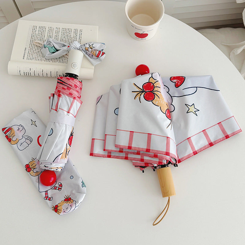 Ladies folding umbrella with playful children's motif Bowlift
