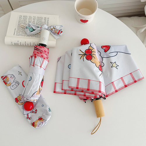 Ladies folding umbrella with playful children's motif Bowlift