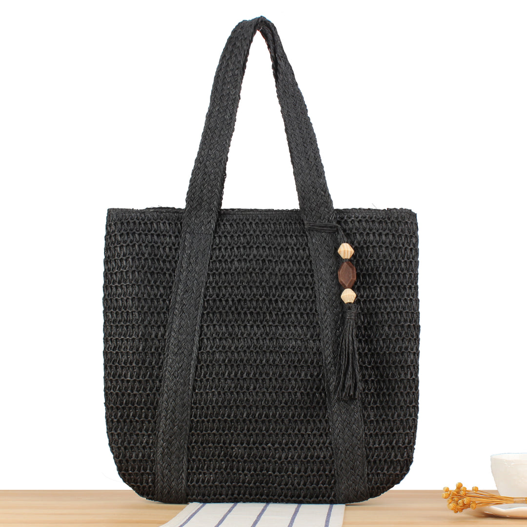 Eco-friendly straw tote bag with elegant tassel detail Bowlift
