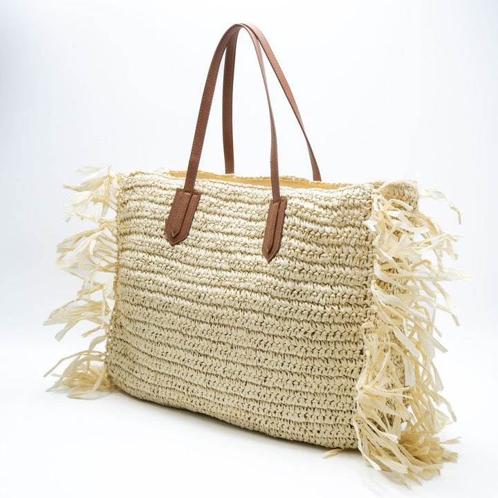 Beach bag made of handwoven straw with fringes Bowlift