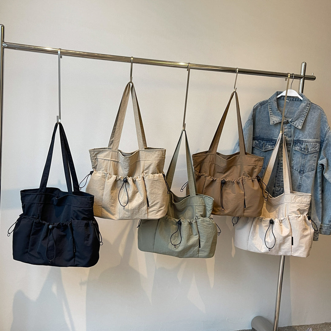 Practical everyday handbag with drawstring Bowlift