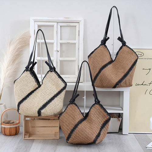 Handbag made of braided natural material with contrasting leather handles Bowlift