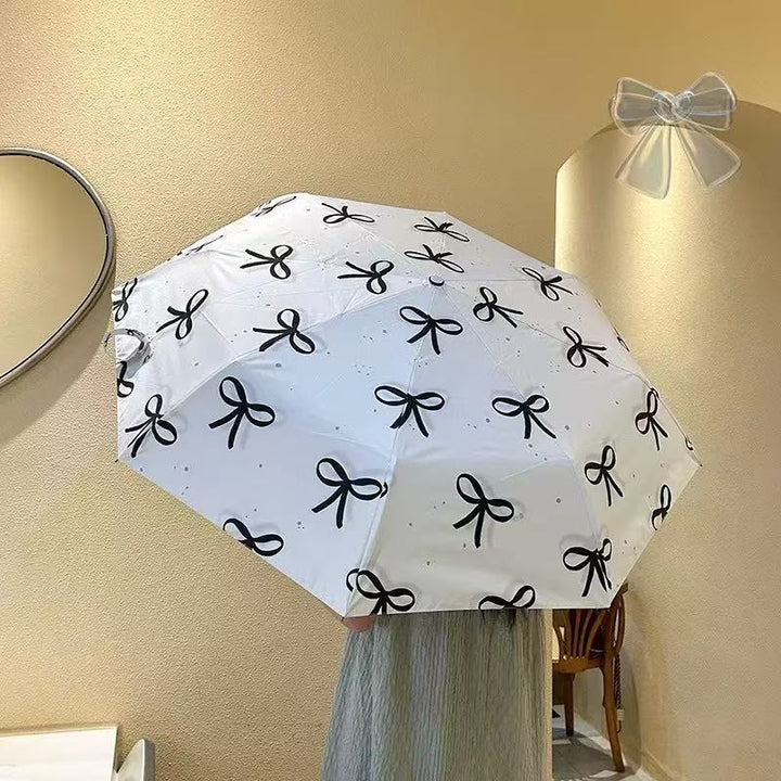 Women's foldable umbrella with elegant bow design Bowlift