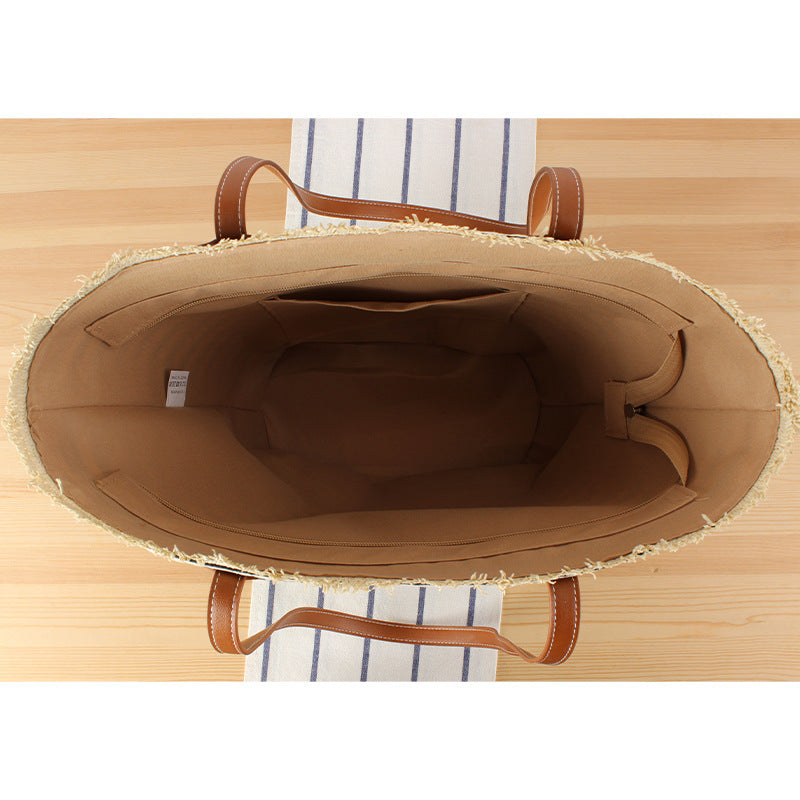 Braided beach bag with modern stripes and sturdy handles Bowlift