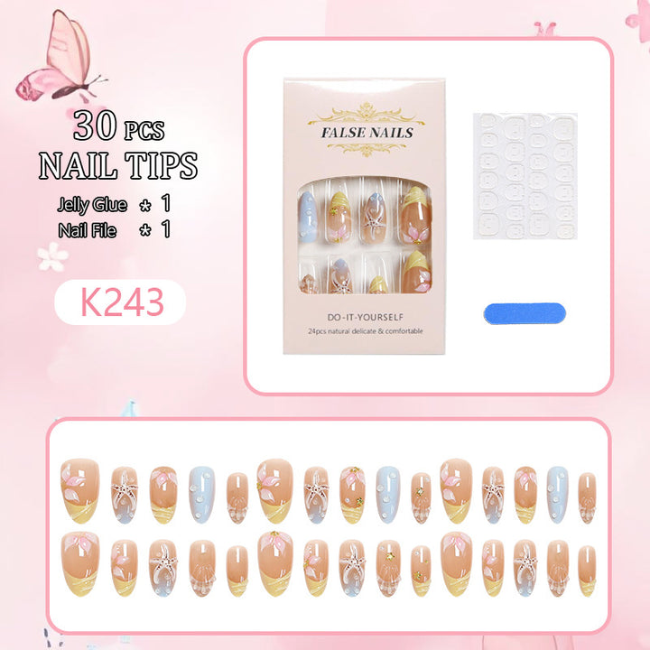 Artificial nail set with floral motifs and glitter accents Bowlift