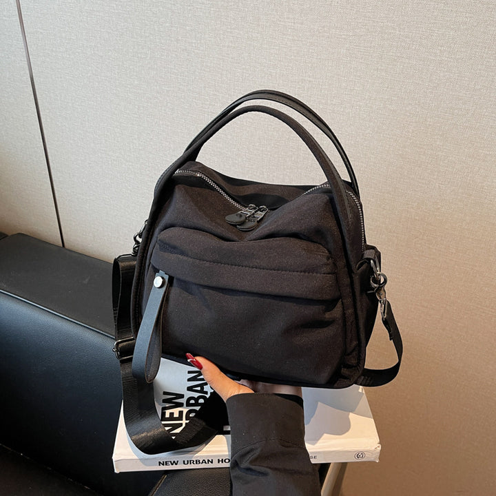 Fashionable shoulder bag with innovative structure and detachable carrying strap Bowlift