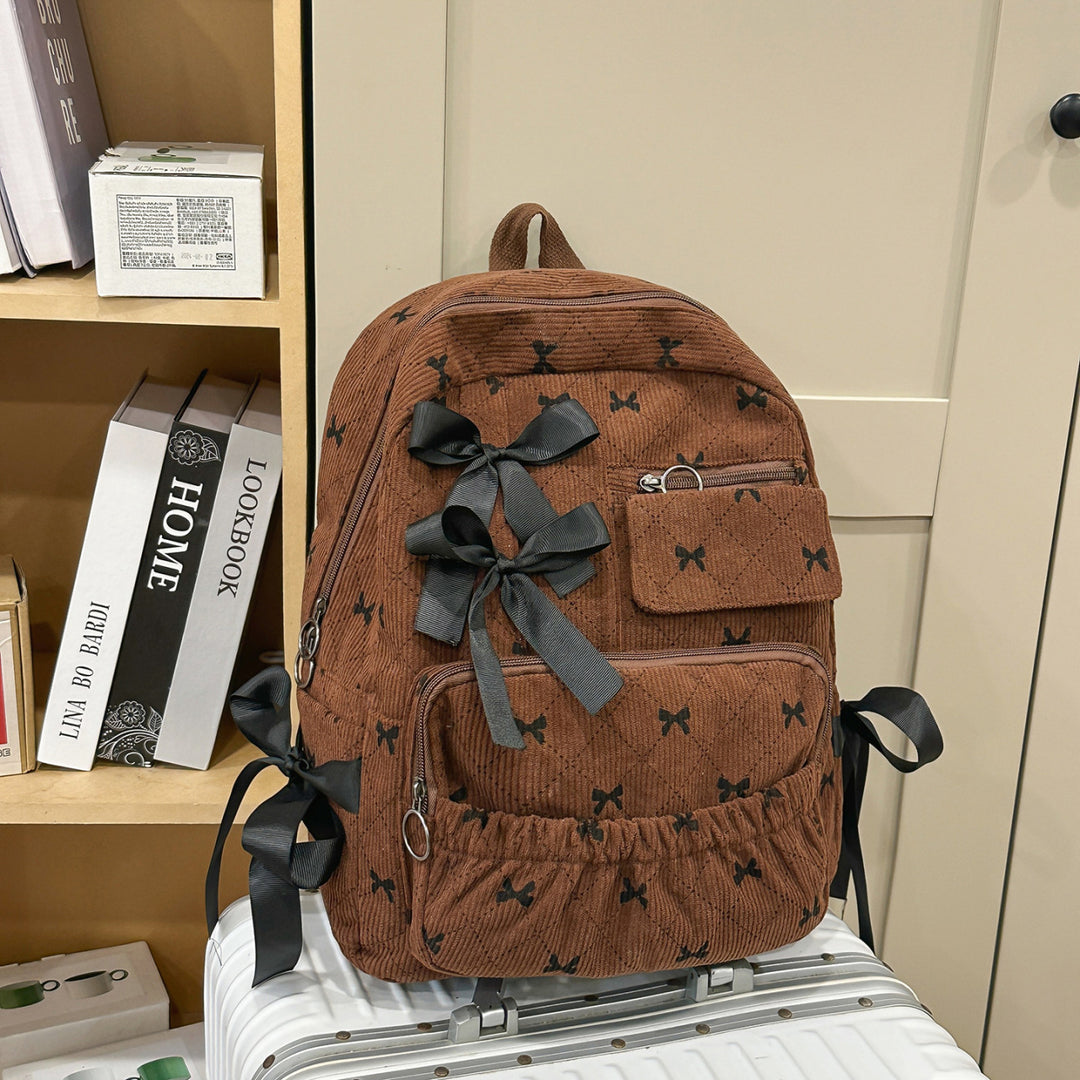 Playful backpack with bow details and practical compartments Bowlift