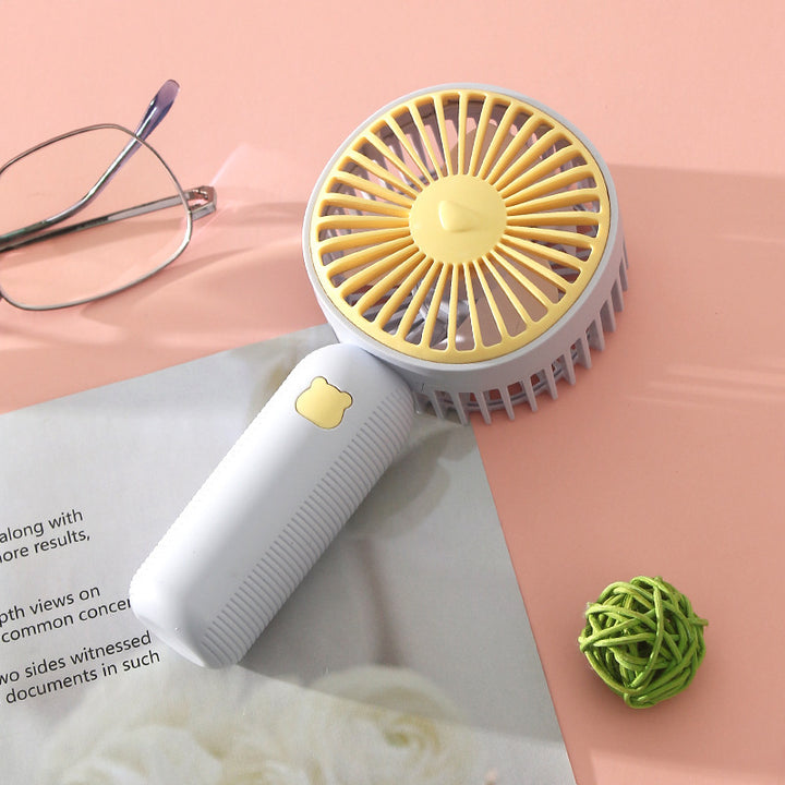 Ladies compact handheld fan with ergonomic grip, quiet brushless motor, and removable stand Bowlift