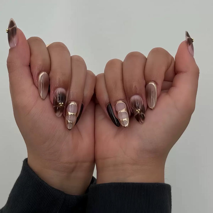 Artificial nail set with elegant ombre design and gold embellishments Bowlift