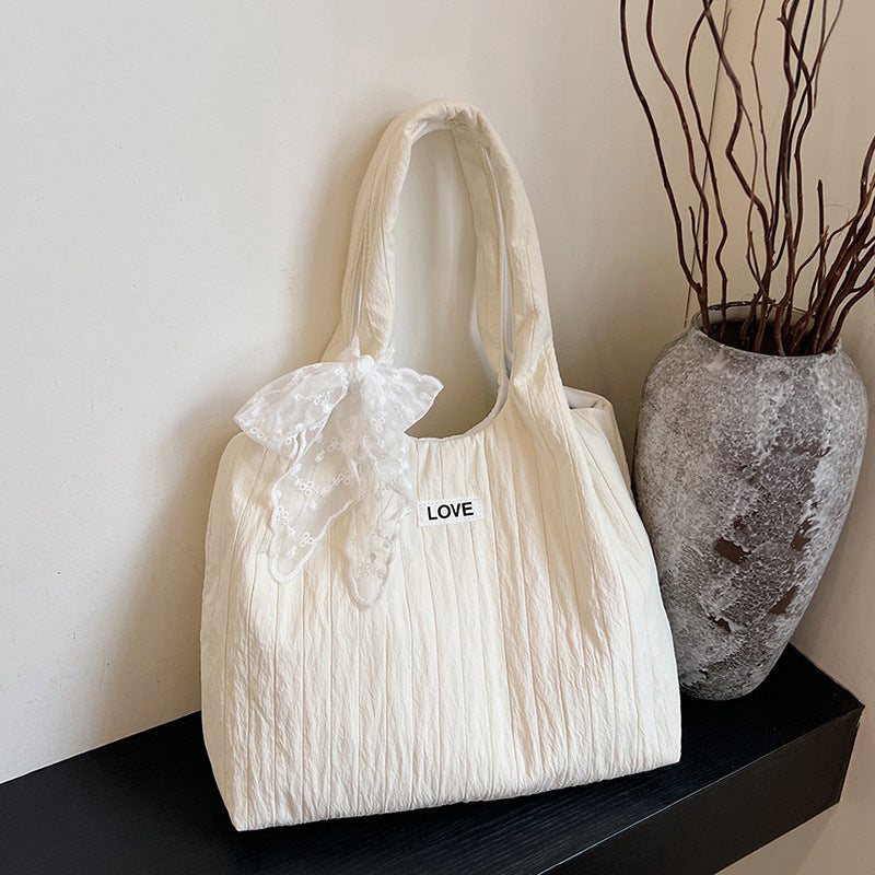 Leisure bag with structured design and playful scarf Bowlift