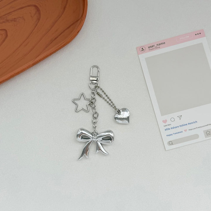 Playful Bow and Star Keychain Bowlift