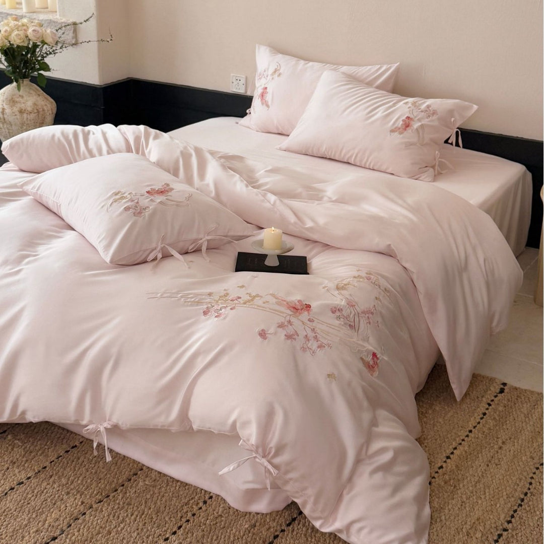 Embroidered satin bedding set with ribbon ties and delicate floral embroidery Bowlift