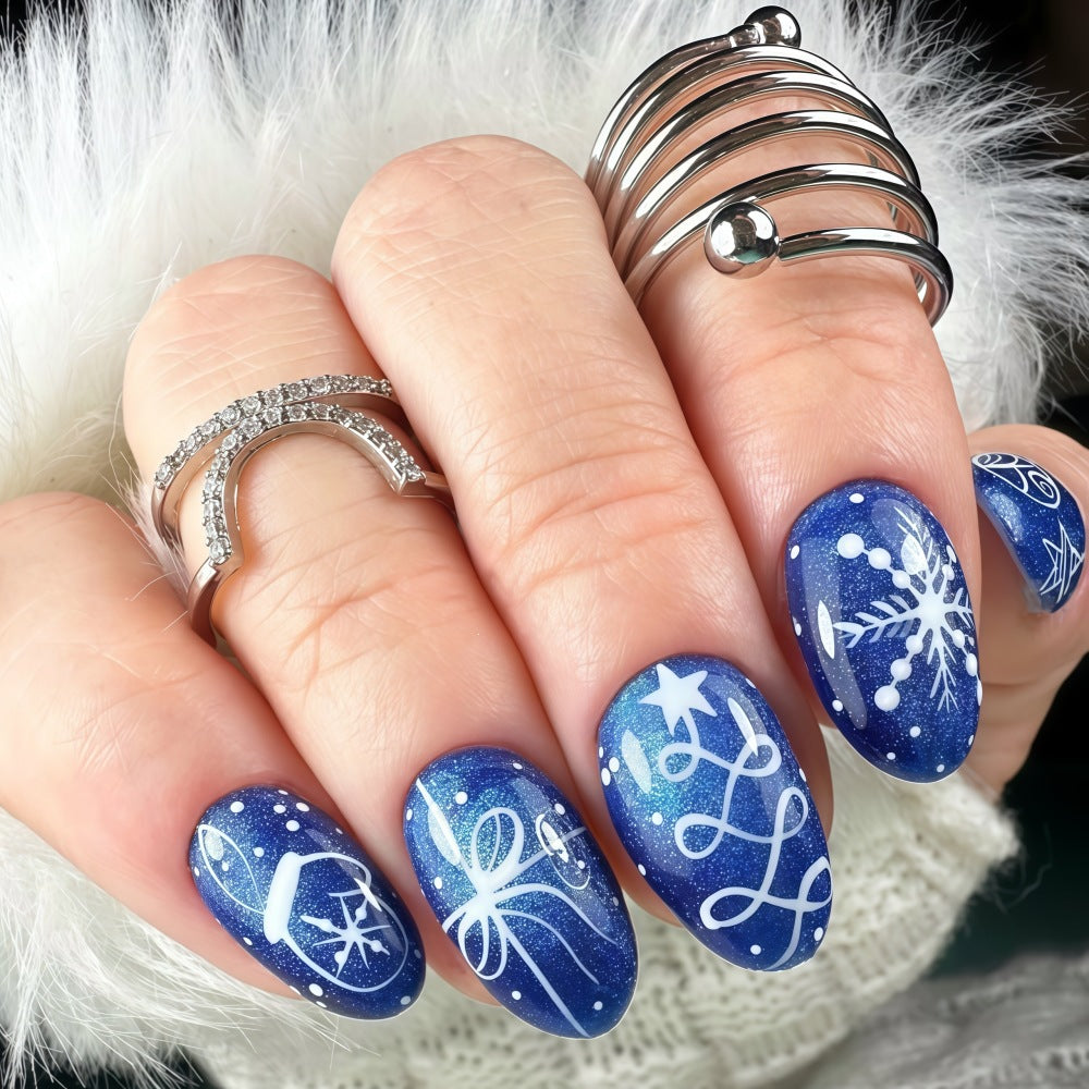 Artificial nails in festive winter design with glittering snowflakes and elegant decorations Bowlift
