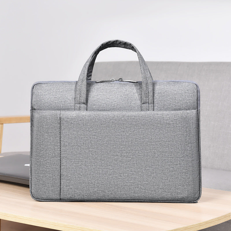 Laptop and briefcase in modern, minimalist design Bowlift