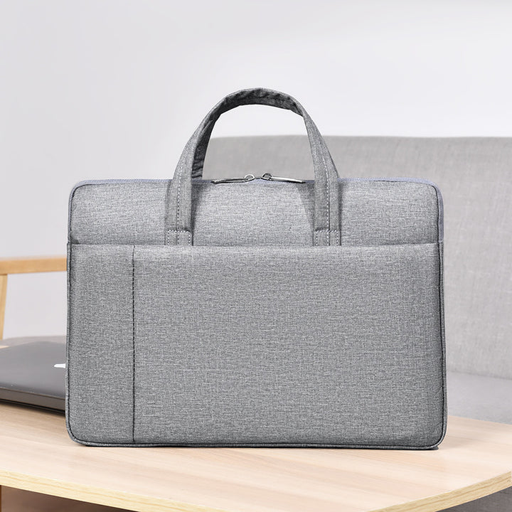 Laptop and briefcase in modern, minimalist design Bowlift