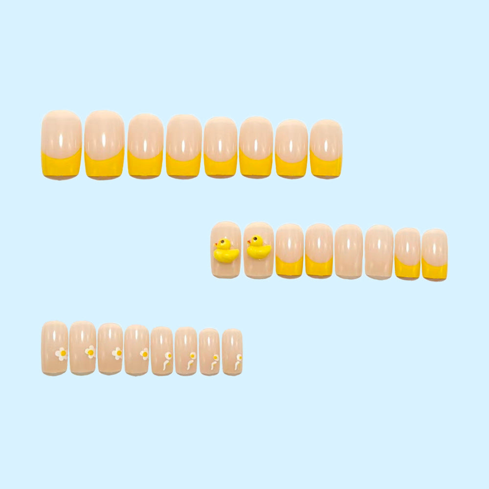 Artificial nails with playful duck motif and spring accents Bowlift