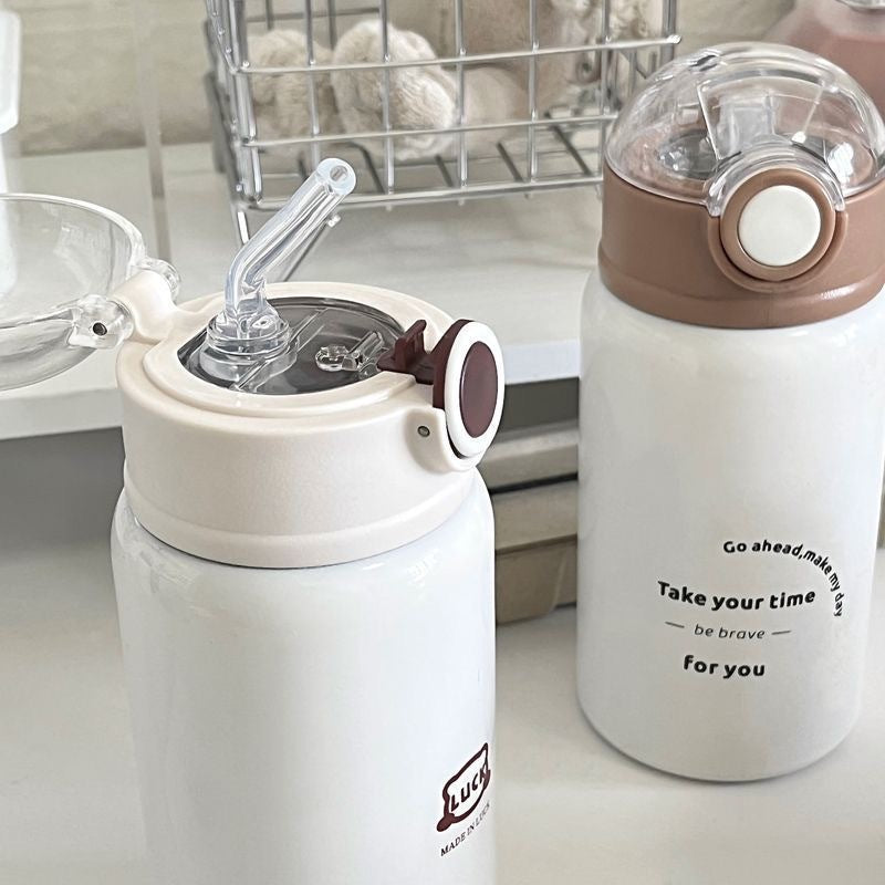Women's insulated drinking bottle with innovative flip lid and practical handle Bowlift