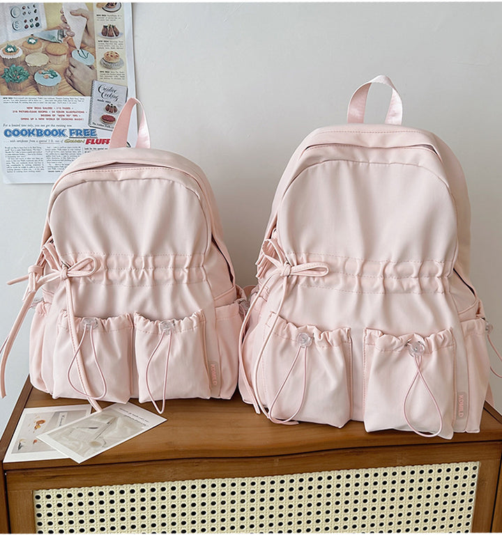 City backpack with innovative compartment system and adjustable carrying straps Bowlift