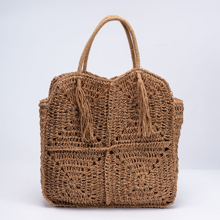 Handcrafted straw beach bag with decorative fringes Bowlift