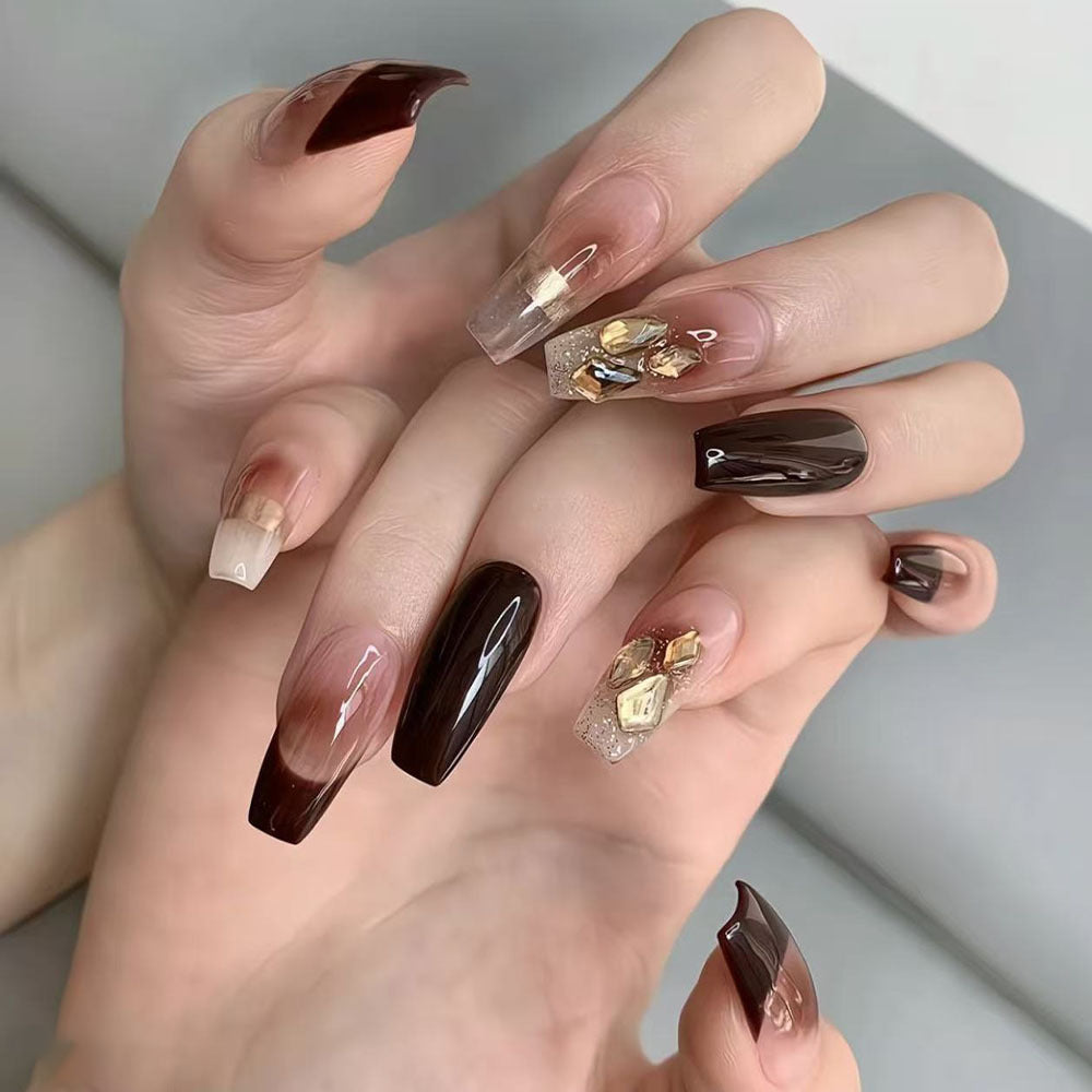 Luxurious artificial nails with glamorous decorations Bowlift