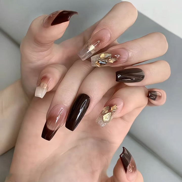 Luxurious artificial nails with glamorous decorations Bowlift