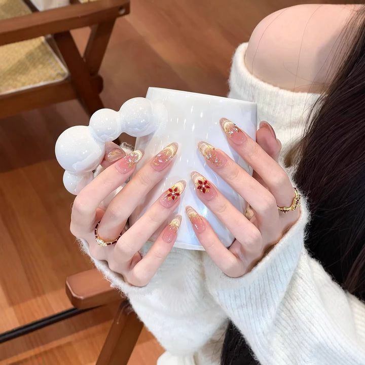 Artificial nails with elegant flower design and glitter accents Bowlift