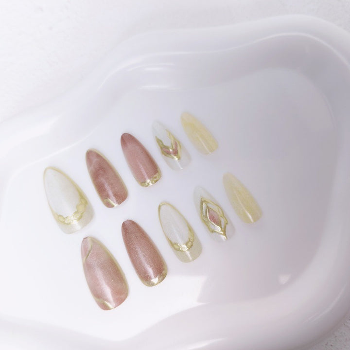 Artificial nails with floral gold accents and glossy finish Bowlift