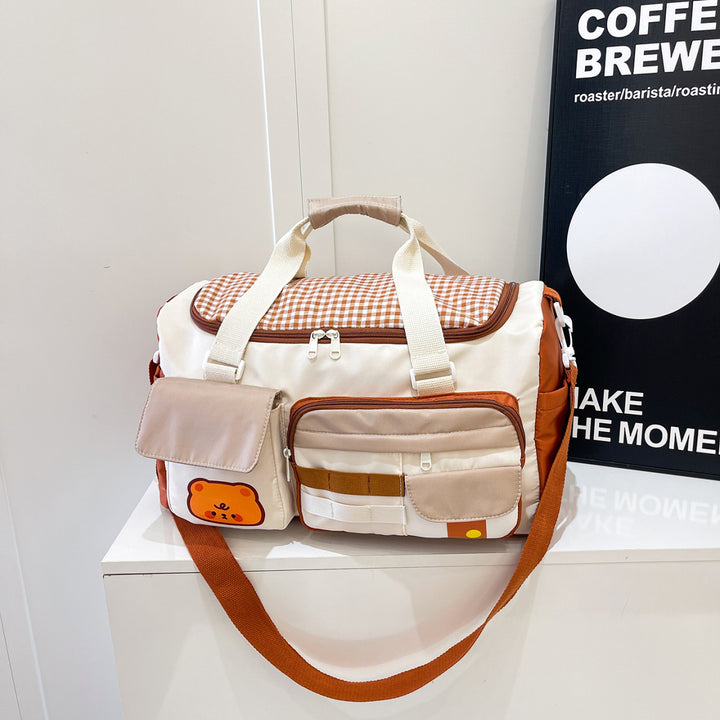 Sporty travel bag with multiple outer pockets Bowlift