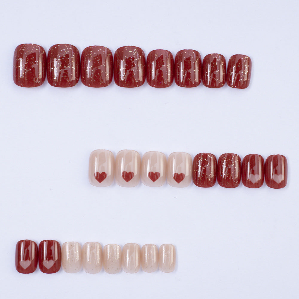 Art nail set with heart designs and glitter Bowlift