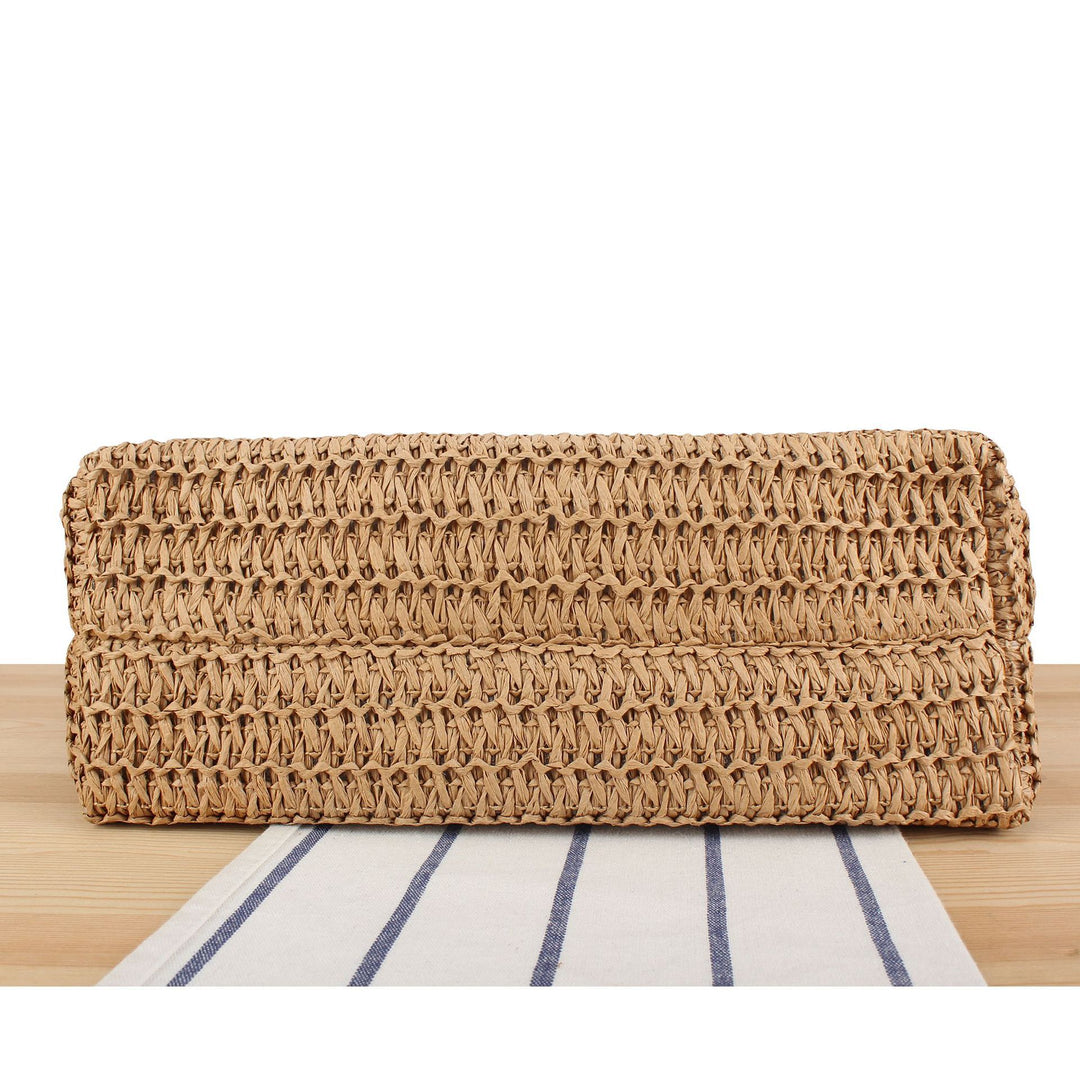 Beach bag made of handwoven natural material with fringe decoration Bowlift