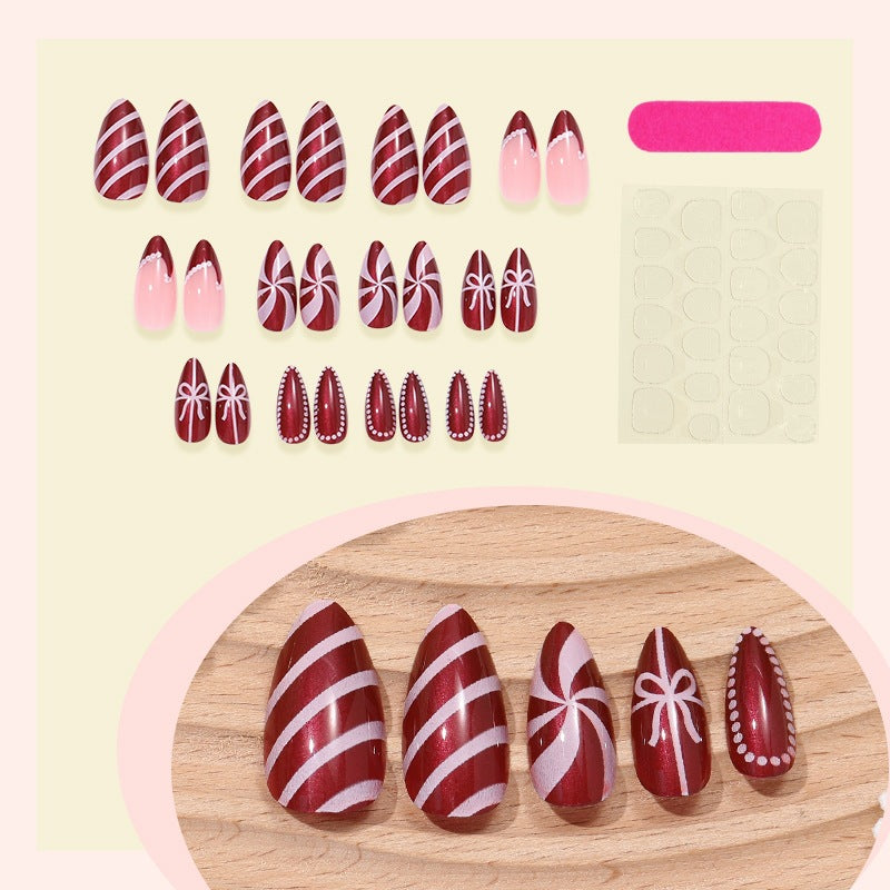 Creative nail art set with festive caramel and stripe designs Bowlift