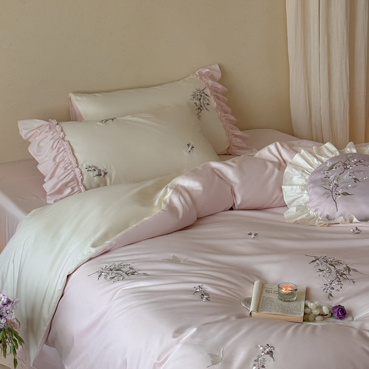Luxurious satin bedding set with ruffles and delicate floral embroidery Bowlift