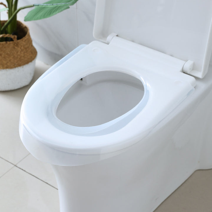 Padded toilet seat reducer with non-slip grips Bowlift